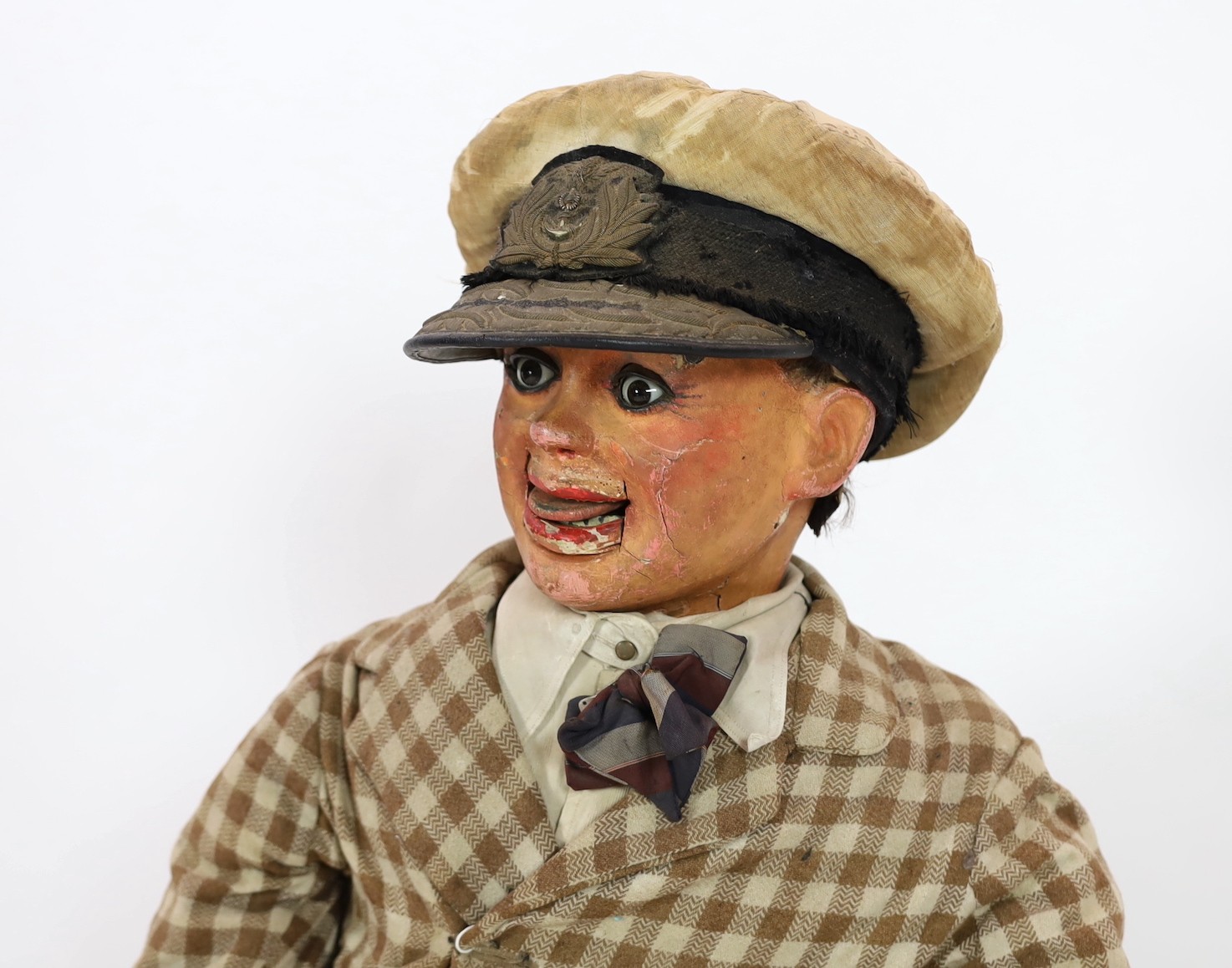 A Leonard Insull ventriloquist's dummy, approx. 130cm high, with walnut box seat